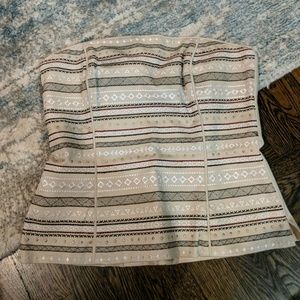 Bustier-style strapless top, embroidery on tan
